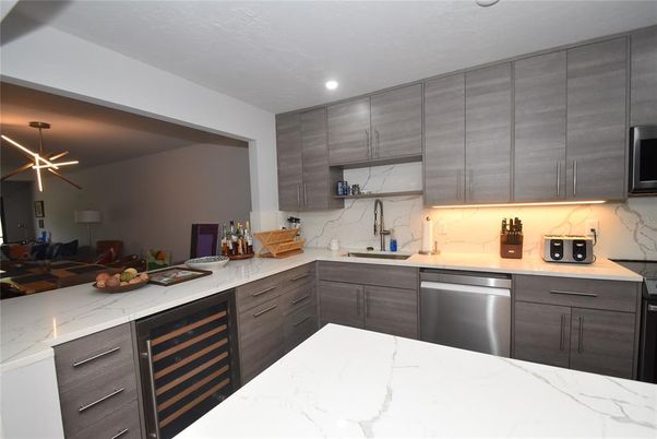 Interior, Kitchen, Marble Walls, Recessed Lighting, Stainless Steel Appliances