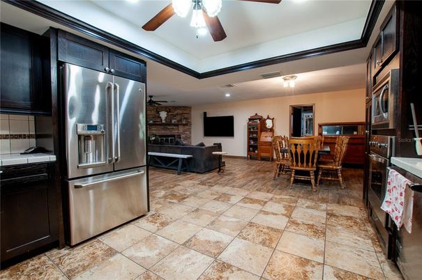 Dining room, Fireplace, Interior, Kitchen, Living room, Recessed Lighting, Stainless Steel Appliances