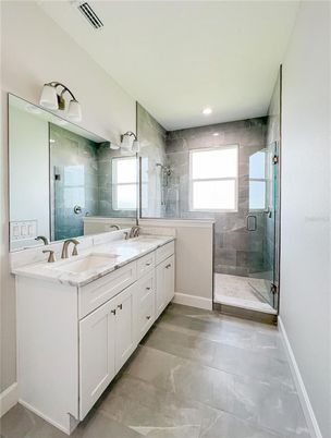 Bathroom, Dual Sink Vanities, Glass Shower, Interior, Marble Walls, Recessed Lighting