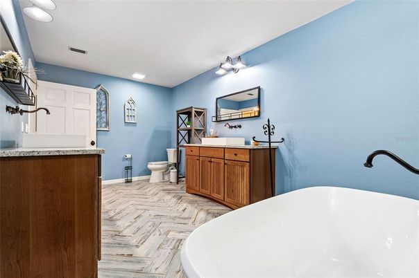 Bathroom, Dual Sink Vanities, Free Standing Baths, Interior, Recessed Lighting, Wood Texture Flooring
