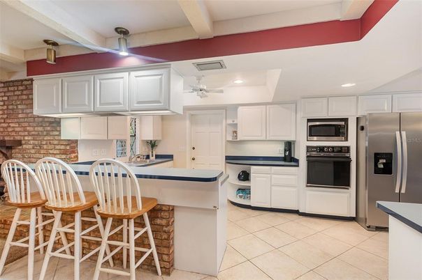 Interior, Kitchen, Recessed Lighting, Stainless Steel Appliances, Stone Walls