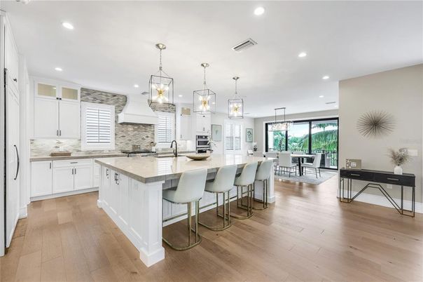 Dining room, Interior, Kitchen, Pendant Lights, Recessed Lighting, Stainless Steel Appliances, Wood Texture Flooring