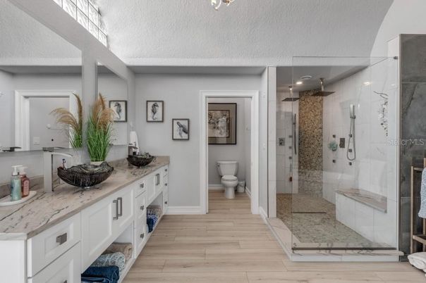 Bathroom, Glass Shower, Interior, Marble Walls, Wood Texture Flooring