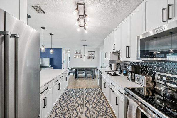 Dining room, Interior, Kitchen, Pendant Lights, Stainless Steel Appliances, Wood Texture Flooring