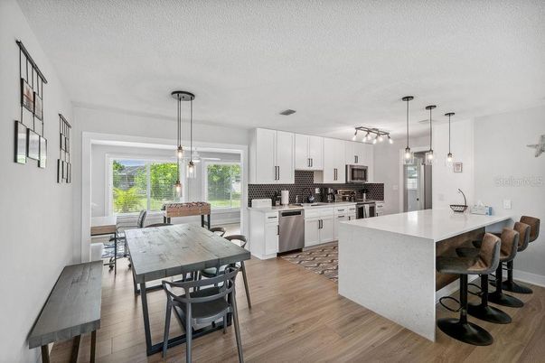 Dining room, Interior, Kitchen, Pendant Lights, Stainless Steel Appliances, Wood Texture Flooring