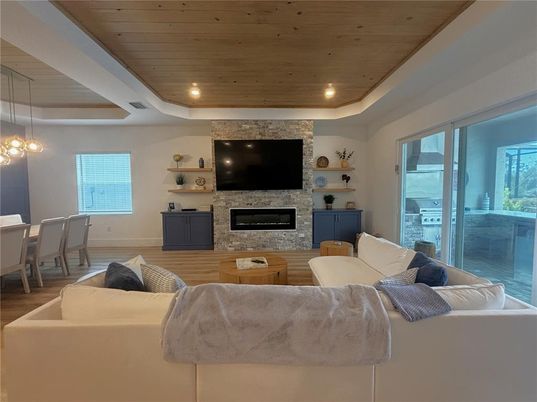 Dining room, Fireplace, Interior, Living room, Pendant Lights, Recessed Lighting, Wooden Ceilings, Wood Texture Flooring