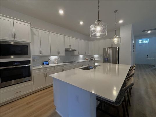 Interior, Kitchen, Pendant Lights, Recessed Lighting, Stainless Steel Appliances, Wood Texture Flooring