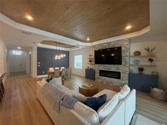 Dining room, Fireplace, Interior, Living room, Pendant Lights, Recessed Lighting, Stone Walls, Wooden Ceilings, Wood Texture Flooring