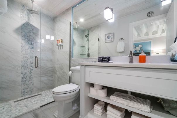 Bathroom, Glass Shower, Interior, Marble Walls, Recessed Lighting, Wood Texture Flooring