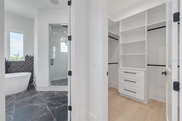 Bathroom, Free Standing Baths, Glass Shower, Interior, Marble, Walk-in Closets, Wood Texture Flooring