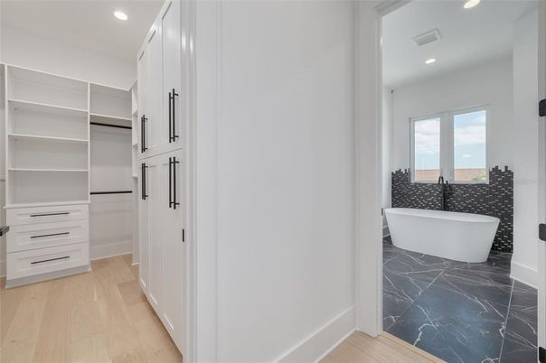 Bathroom, Free Standing Baths, Interior, Marble, Recessed Lighting, Walk-in Closets, Wood Texture Flooring
