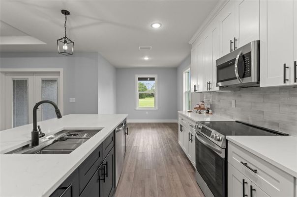 Interior, Kitchen, Pendant Lights, Recessed Lighting, Stainless Steel Appliances, Wood Texture Flooring