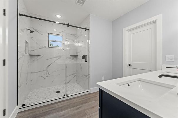 Bathroom, Glass Shower, Interior, Marble Walls, Recessed Lighting, Wood Texture Flooring