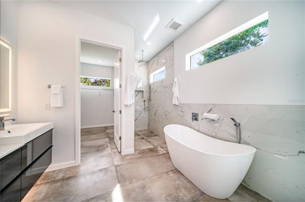 Bathroom, Free Standing Baths, Glass Shower, Interior, Marble Walls, Recessed Lighting