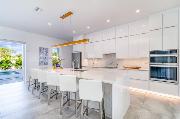 Interior, Kitchen, Marble Walls, Pendant Lights, Recessed Lighting, Stainless Steel Appliances