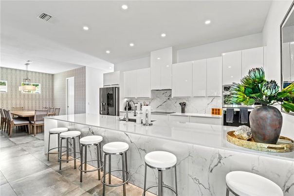 Dining room, Interior, Kitchen, Marble Walls, Pendant Lights, Recessed Lighting, Stainless Steel Appliances