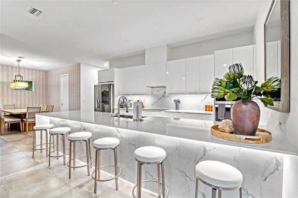 Dining room, Interior, Kitchen, Marble Walls, Pendant Lights, Recessed Lighting, Stainless Steel Appliances