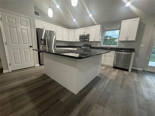 Interior, Kitchen, Pendant Lights, Recessed Lighting, Stainless Steel Appliances, Wood Texture Flooring