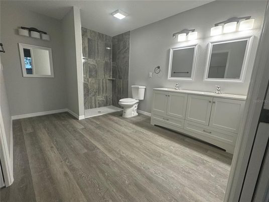 Bathroom, Dual Sink Vanities, Glass Shower, Interior, Wood Texture Flooring
