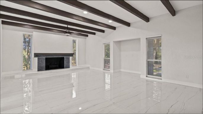 Empty room, Fireplace, Interior, Marble, Recessed Lighting, Wooden Beams