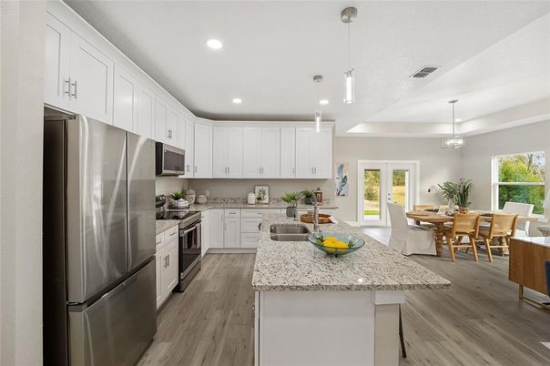 Dining room, Interior, Kitchen, Pendant Lights, Recessed Lighting, Stainless Steel Appliances, Wood Texture Flooring