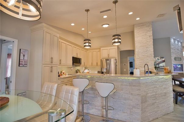 Dining room, Interior, Kitchen, Pendant Lights, Recessed Lighting, Stainless Steel Appliances, Wood Texture Flooring