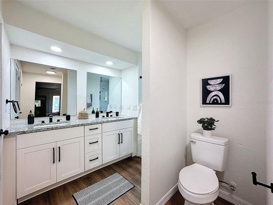 Bathroom, Dual Sink Vanities, Interior, Recessed Lighting, Wood Texture Flooring