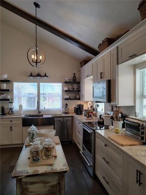 Chandelier, Interior, Kitchen, Pendant Lights, Stainless Steel Appliances, Wood Texture Flooring