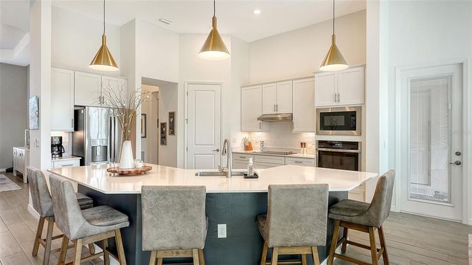 Interior, Kitchen, Pendant Lights, Recessed Lighting, Stainless Steel Appliances, Wood Texture Flooring