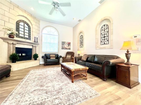 Fireplace, Interior, Living room, Recessed Lighting, Stone Walls, Wood Texture Flooring
