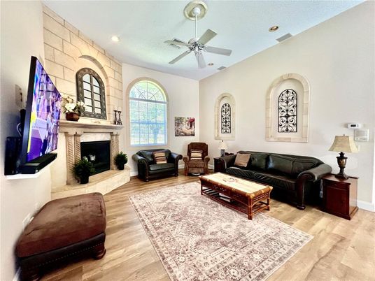 Fireplace, Interior, Living room, Recessed Lighting, Stone Walls, Wood Texture Flooring