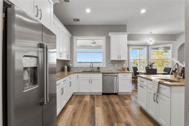 Dining room, Interior, Kitchen, Recessed Lighting, Stainless Steel Appliances, Wood Texture Flooring