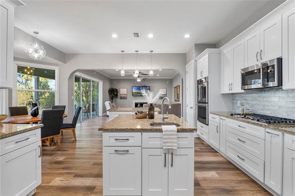 Dining room, Interior, Kitchen, Pendant Lights, Recessed Lighting, Stainless Steel Appliances, Wood Texture Flooring