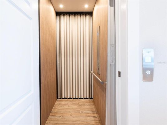 Elevator, Interior, Recessed Lighting, Wood Texture Flooring, Wooden Walls