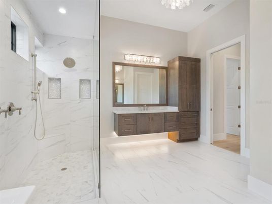 Bathroom, Dual Sink Vanities, Glass Shower, Interior, Marble, Marble Walls, Recessed Lighting