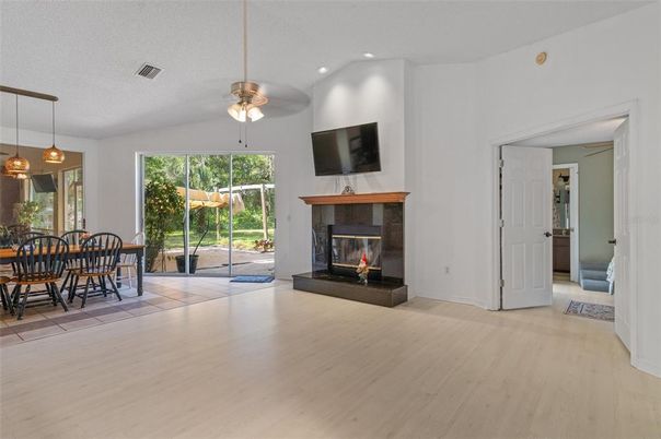 Dining room, Fireplace, Interior, Pendant Lights, Recessed Lighting, Wood Texture Flooring