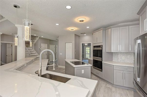 Interior, Kitchen, Pendant Lights, Recessed Lighting, Stainless Steel Appliances, Wood Texture Flooring