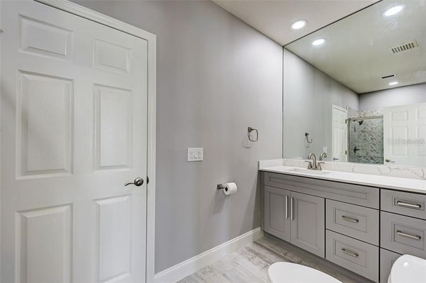 Bathroom, Dual Sink Vanities, Interior, Recessed Lighting, Wood Texture Flooring
