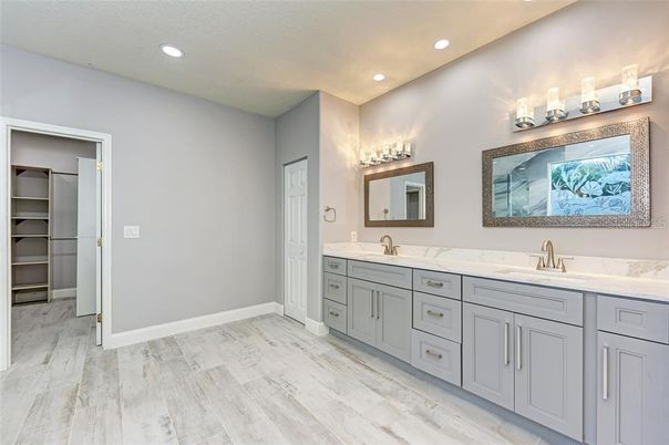 Bathroom, Dual Sink Vanities, Interior, Recessed Lighting, Walk-in Closets, Wood Texture Flooring