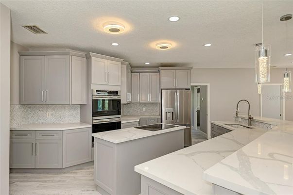 Interior, Kitchen, Pendant Lights, Recessed Lighting, Stainless Steel Appliances, Wood Texture Flooring