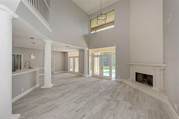 Fireplace, Interior, Pendant Lights, Recessed Lighting, Wood Texture Flooring