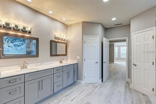Bathroom, Dual Sink Vanities, Interior, Recessed Lighting, Wood Texture Flooring