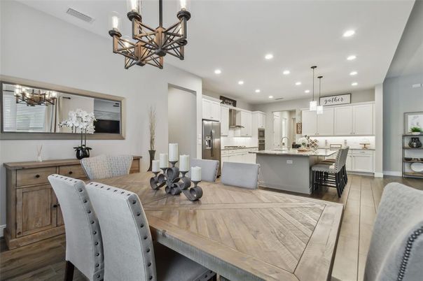 Chandelier, Dining room, Interior, Kitchen, Pendant Lights, Recessed Lighting, Stainless Steel Appliances, Wood Texture Flooring