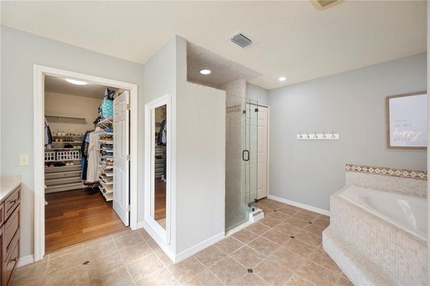 Bathroom, Glass Shower, Interior, Recessed Lighting, Walk-in Closets, Wood Texture Flooring