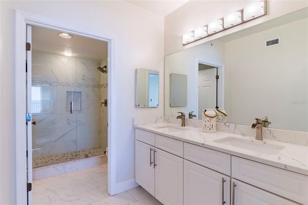Bathroom, Dual Sink Vanities, Glass Shower, Interior, Marble, Marble Walls, Recessed Lighting