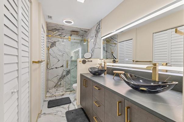 Bathroom, Dual Sink Vanities, Glass Shower, Interior, Marble, Marble Walls, Recessed Lighting
