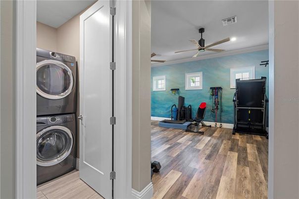 Fitness Equipment, Interior, Recessed Lighting, Utility Closets, Washer, Wood Texture Flooring