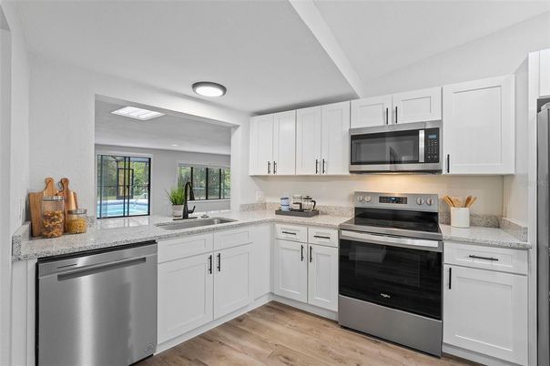 Interior, Kitchen, Recessed Lighting, Stainless Steel Appliances, Wood Texture Flooring