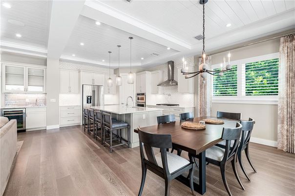 Dining room, Interior, Kitchen, Pendant Lights, Recessed Lighting, Stainless Steel Appliances, Wood Texture Flooring