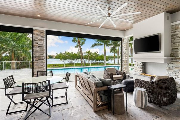 Fireplace, Interior, Living room, Pool, Recessed Lighting, Stone Walls, Sun Room, Wooden Ceilings